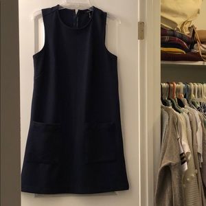 Navy blue sleeveless shift dress with pockets